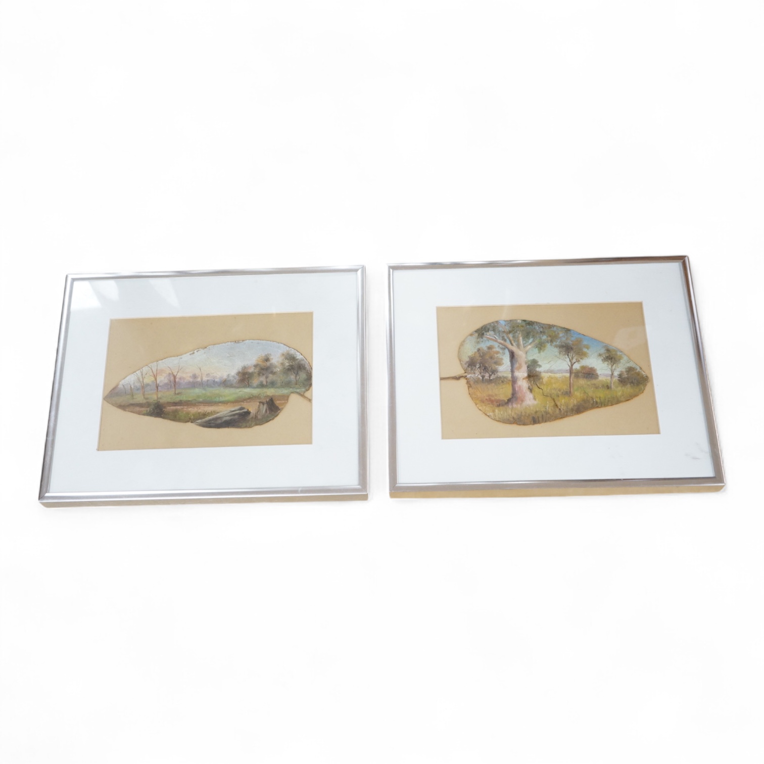 Two Australian leaf paintings, Outback views, 11 x 16cm. Condition - poor to fair